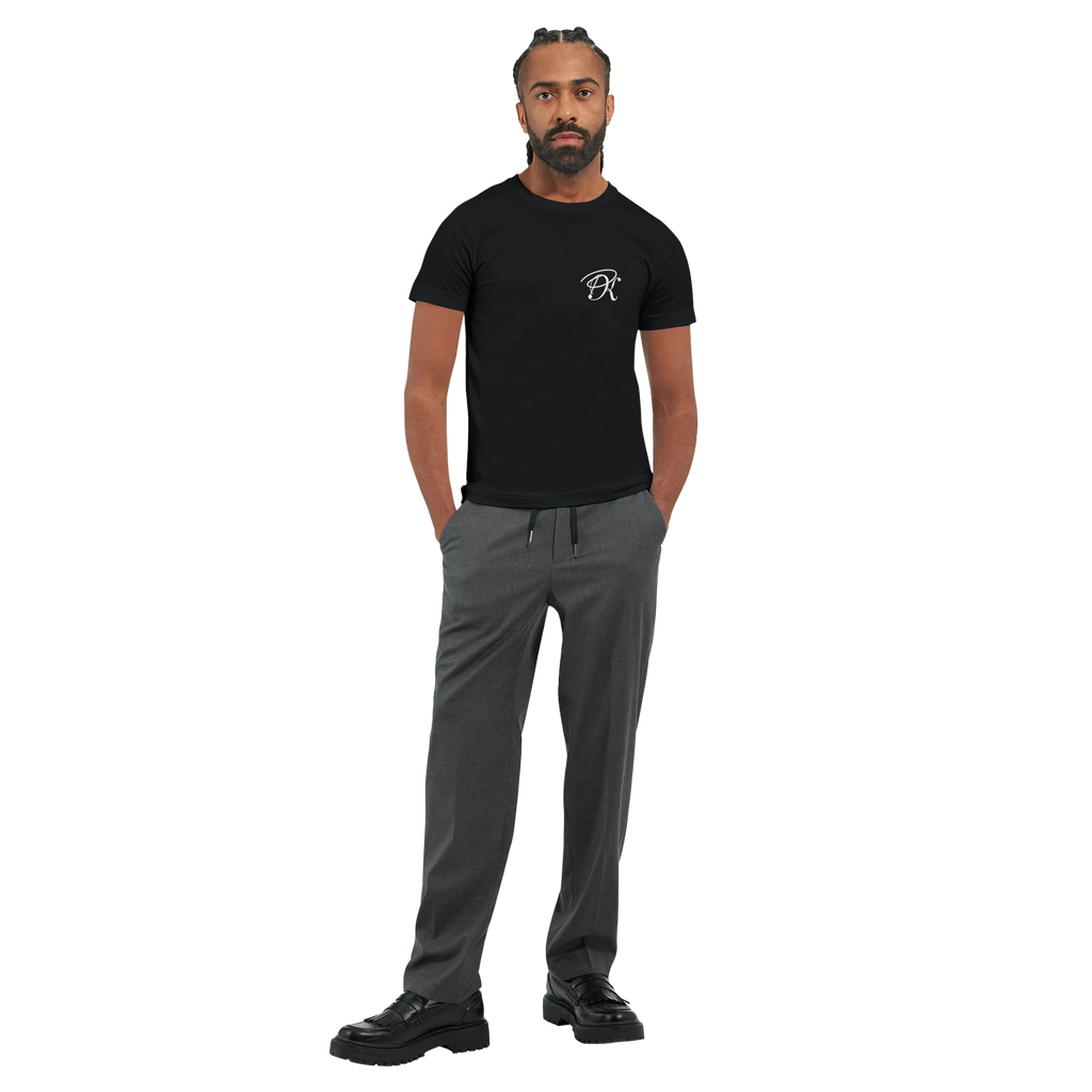 Black unisex statement T-shirt with a small white PK monogram on the chest, shown on a male model in a minimalist front view.