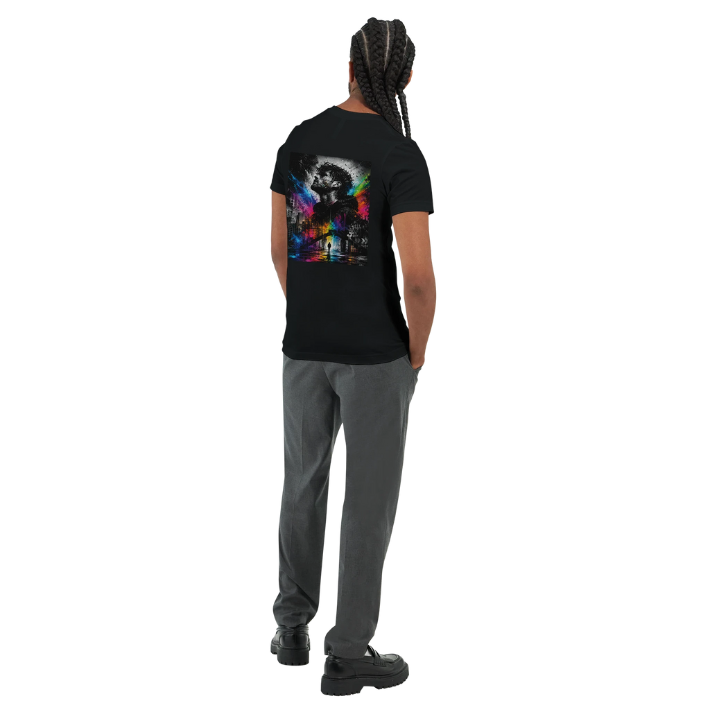 Rear three-quarter view of a male model wearing a black unisex T-shirt with a large surreal urban back print featuring a monochrome male portrait, city elements, and vivid rainbow neon splashes.