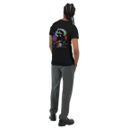 Rear three-quarter view of a male model wearing a black unisex T-shirt with a large surreal urban back print featuring a monochrome male portrait, city elements, and vivid rainbow neon splashes.