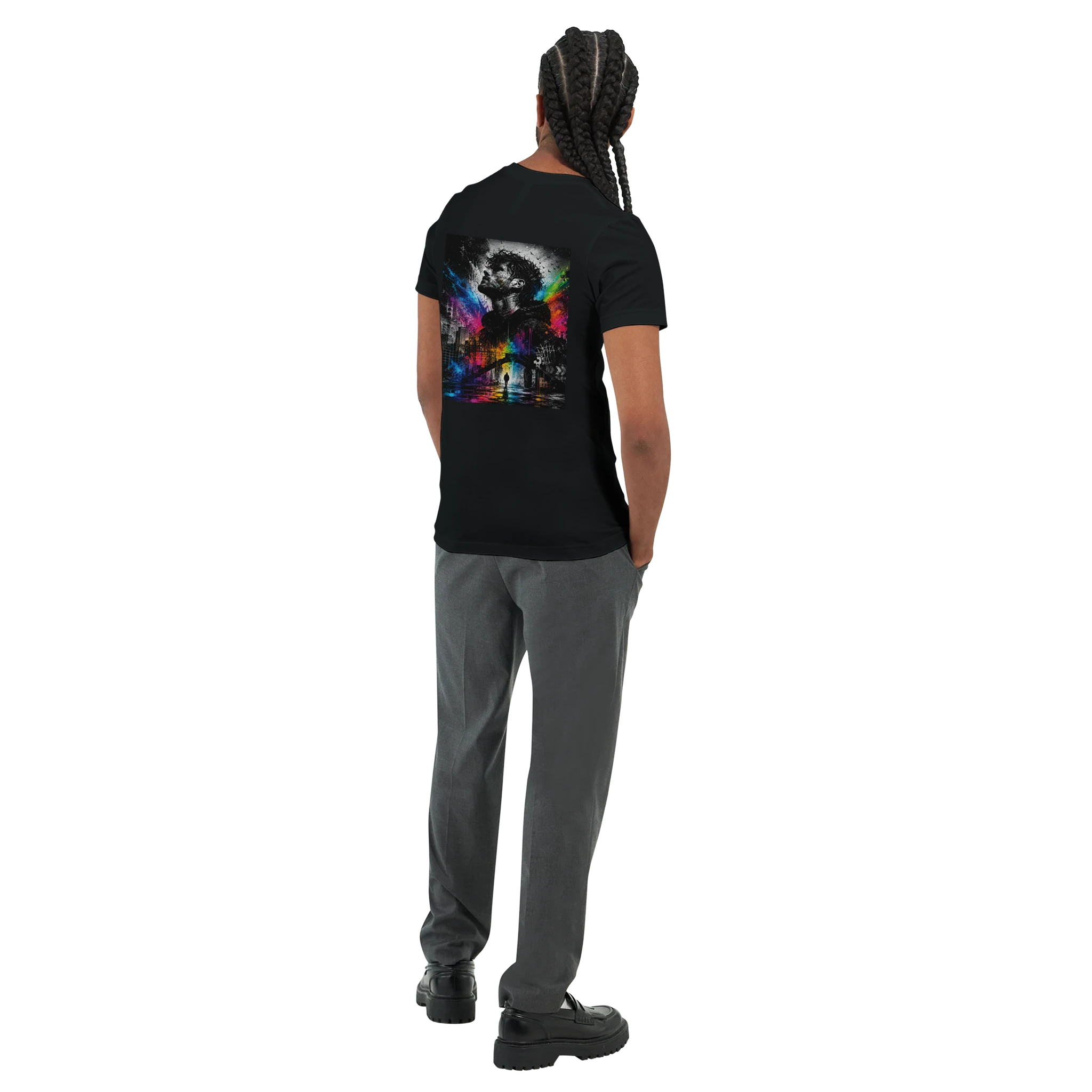 Rear three-quarter view of a male model wearing a black unisex T-shirt with a large surreal urban back print featuring a monochrome male portrait, city elements, and vivid rainbow neon splashes.