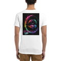 White unisex T-shirt shown from the back, featuring a colorful surreal neon lips design with the statement “SPEAK UP” in pink and turquoise.