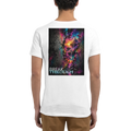 Back view of a white unisex T-shirt featuring a large “BREAK THROUGH” back print with a surreal neon landscape emerging through a cracked dark wall in pink, turquoise, purple, and yellow tones.