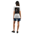 Female model shown from behind wearing a white T-shirt with a vivid neon rainbow hoodie back print against a black-and-white graffiti background, paired with a blue jeans rock for a modern urban streetwear look.