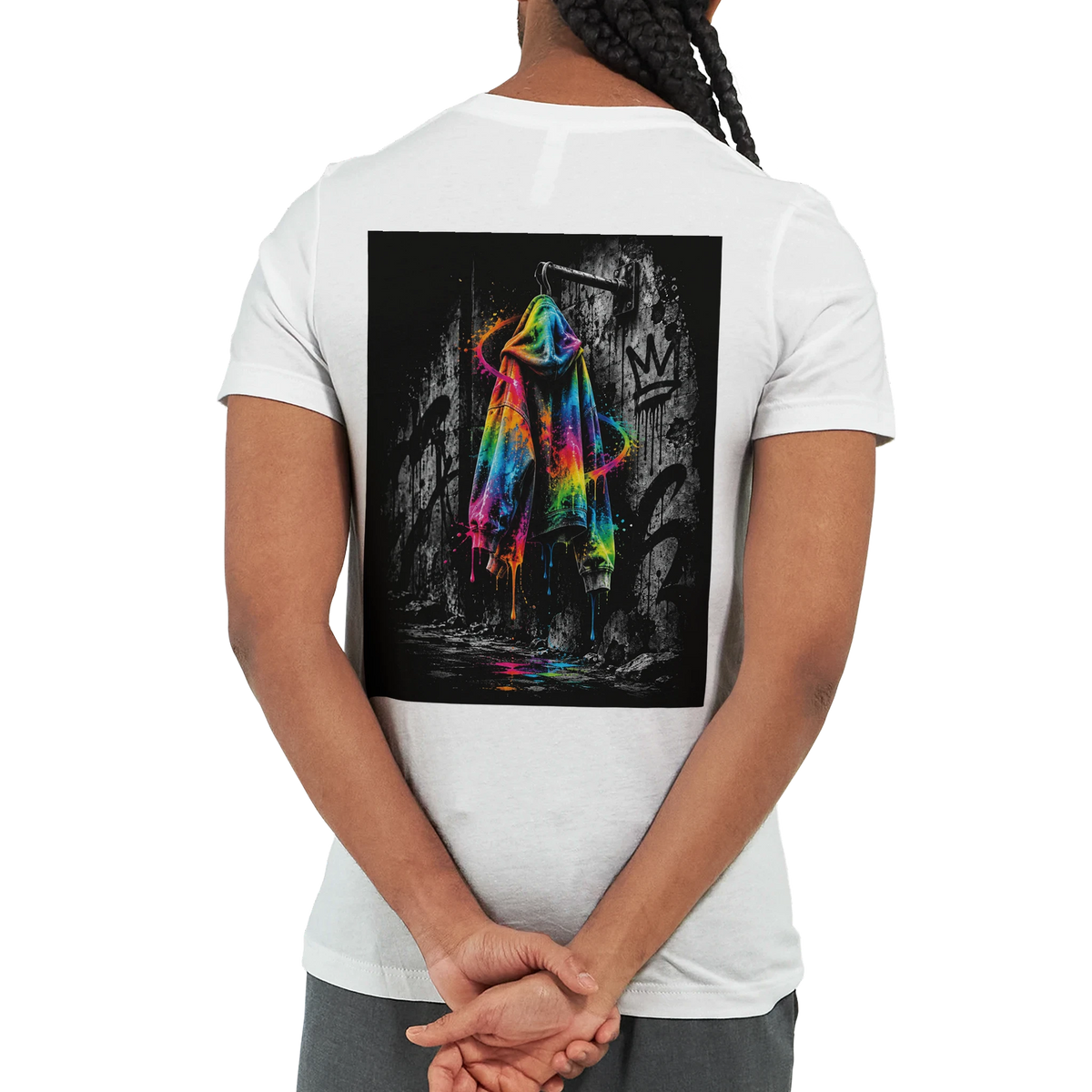 White statement T-shirt featuring a bold back print of a neon rainbow hoodie against a black-and-white graffiti wall. The vivid colors stand out strongly from the monochrome background, creating an expressive urban streetwear look.