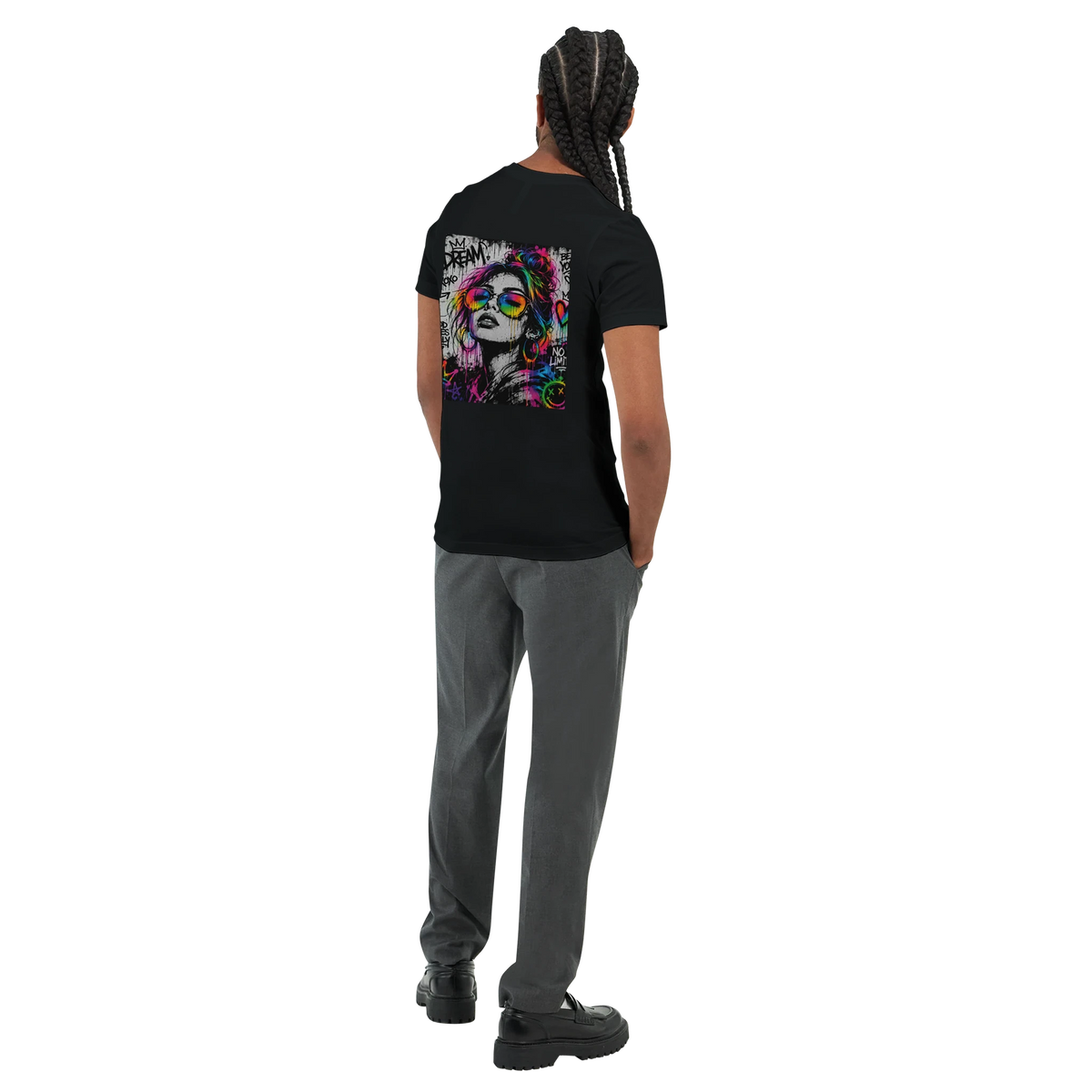 Black unisex statement T-shirt shown from the back on a male model, featuring a large NEON REBEL graffiti artwork with bold black-and-white details and vibrant neon rainbow accents.