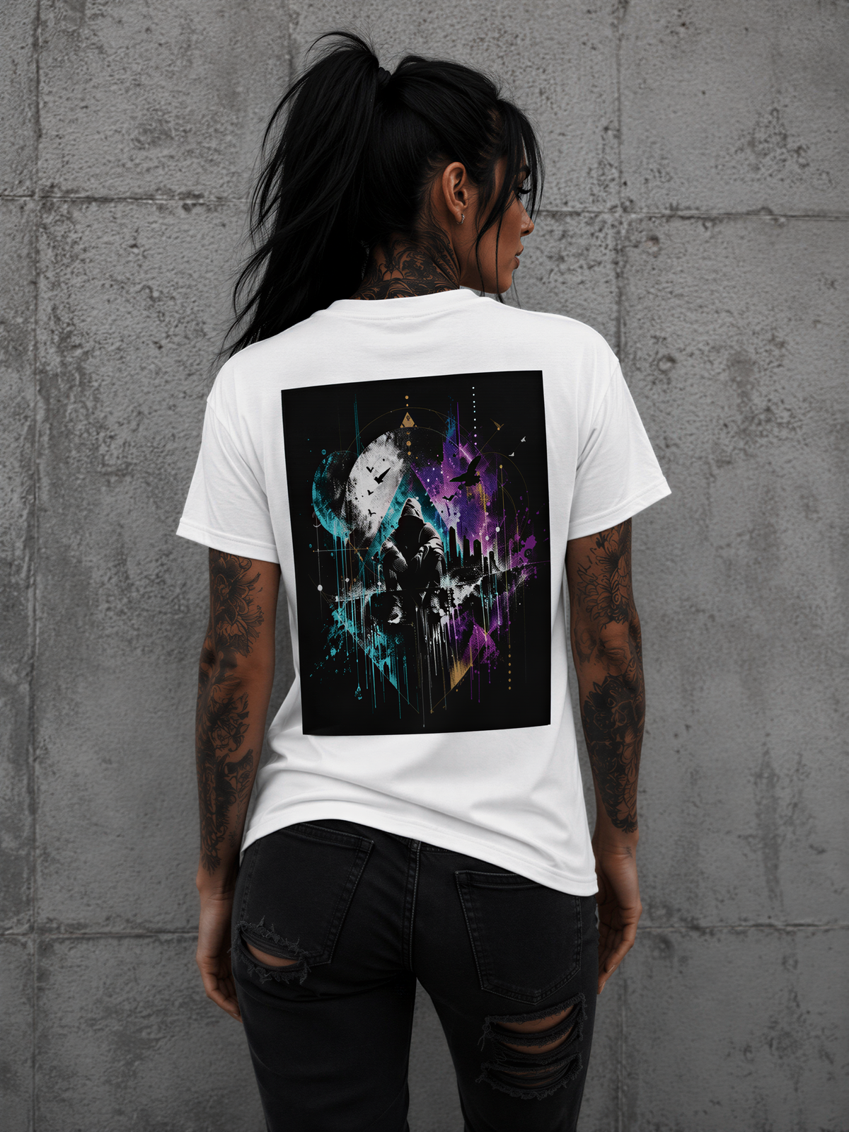 tattooed woman wearing a Personiq Kaleido T-shirt with colorful butterfly artwork on the back, symbolizing transformation and expressive streetwear.