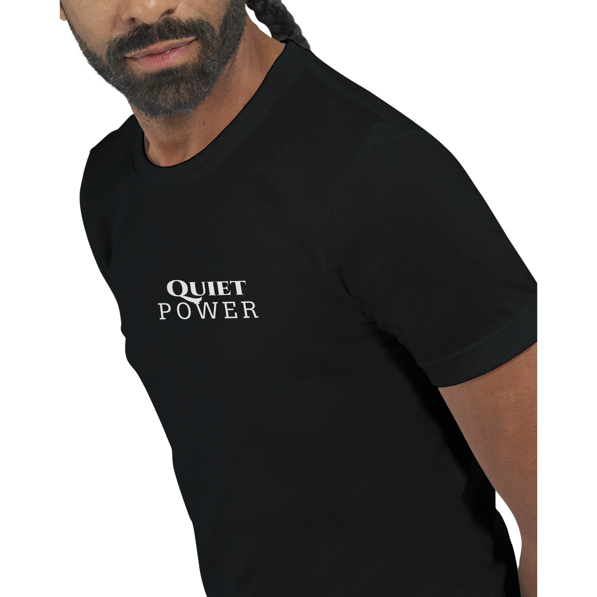 Close-up of a male model wearing a black unisex T-shirt with a small white “QUIET POWER” print centered on the chest.