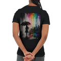 Black unisex T-shirt shown from the back featuring the “Color the Grey” design with a woman under an umbrella, a monochrome city skyline, and neon rainbow graffiti colors.