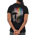 Black unisex T-shirt shown from the back featuring the “Color the Grey” design with a woman under an umbrella, a monochrome city skyline, and neon rainbow graffiti colors.