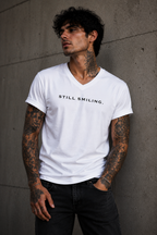 STILL SMILING. – Premium Unisex V-Neck Statement T-Shirt