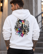 Male model wearing a white Personiq Kaleido hoodie with rolled-up sleeves, featuring a surreal cosmic neon rainbow back print and the statement “A Brighter You Always Exists.”